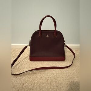 (Like new) Large Kate Spade burgundy and red bag with shoulder strap.